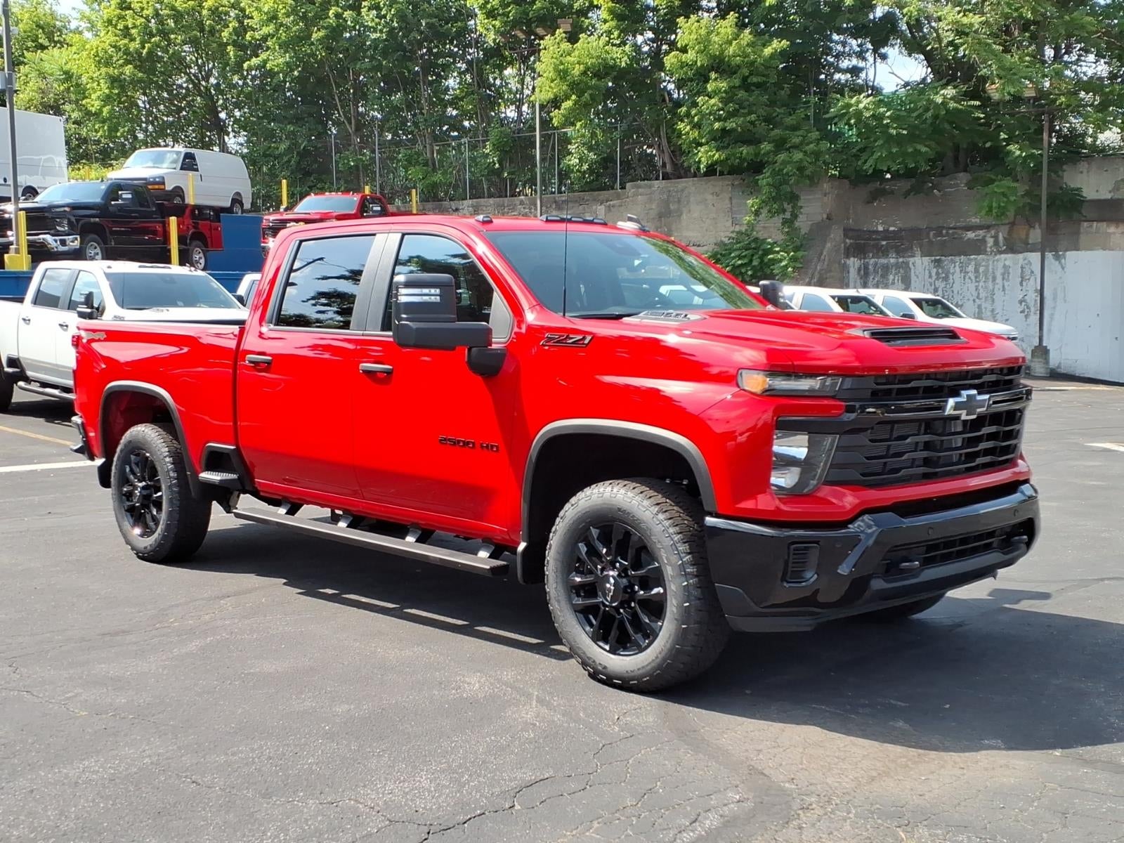 2026 Chevrolet Silverado 2500 HD Custom in Red Hot — front three-quarter view